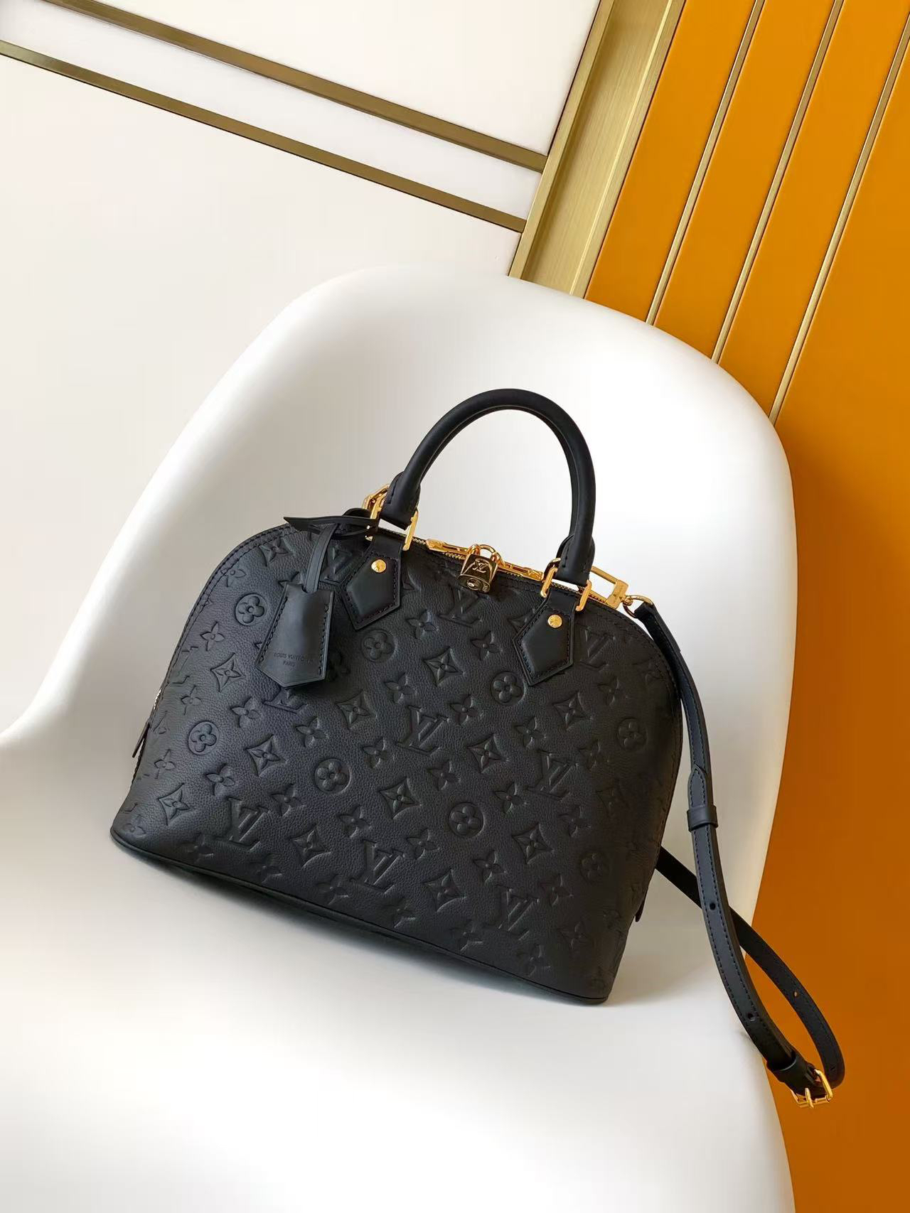 Alma PM Handbag in Black Monogram Empreinte Leather