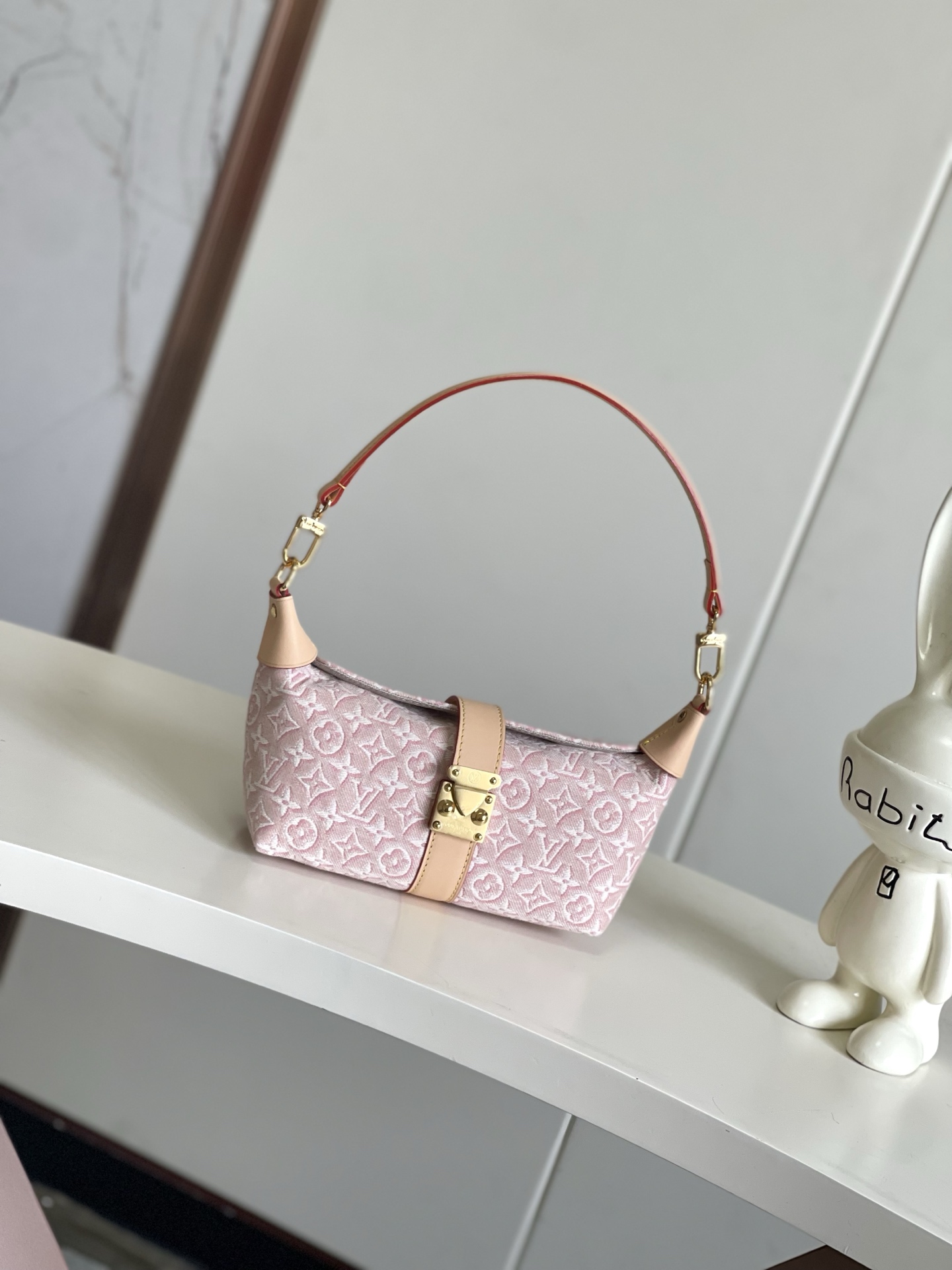 Pochette Mia Handbag in Pink Monogram Emblème Canvas