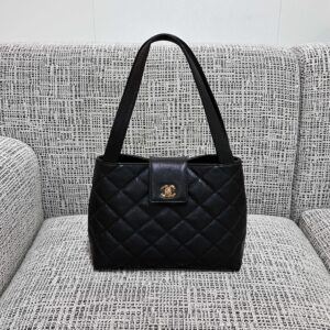 CHANEL Vintage Black and Gold Kelly Handbag