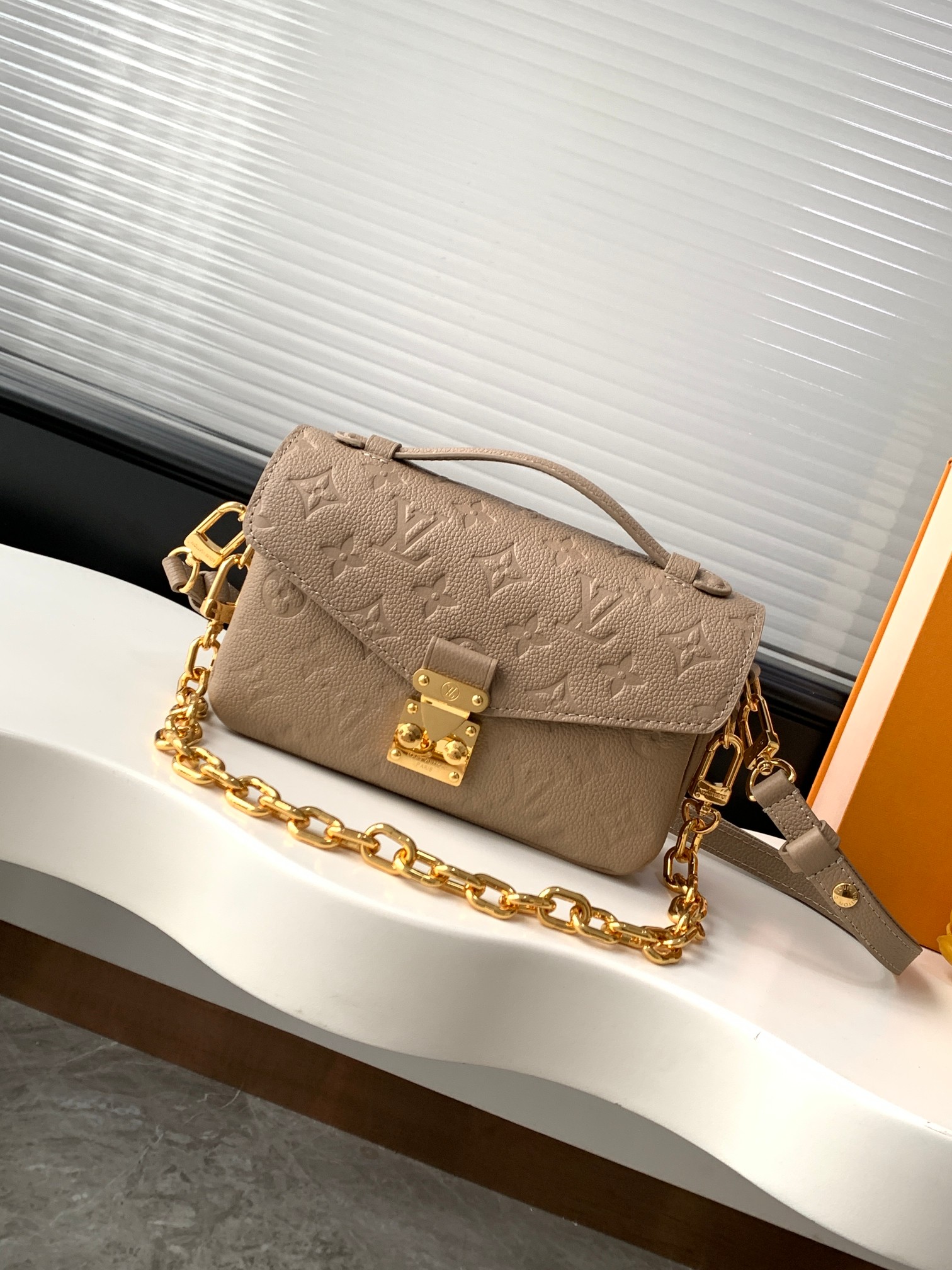 Pochette Metis East West Shoulder Bag in Monogram Empreinte Leather