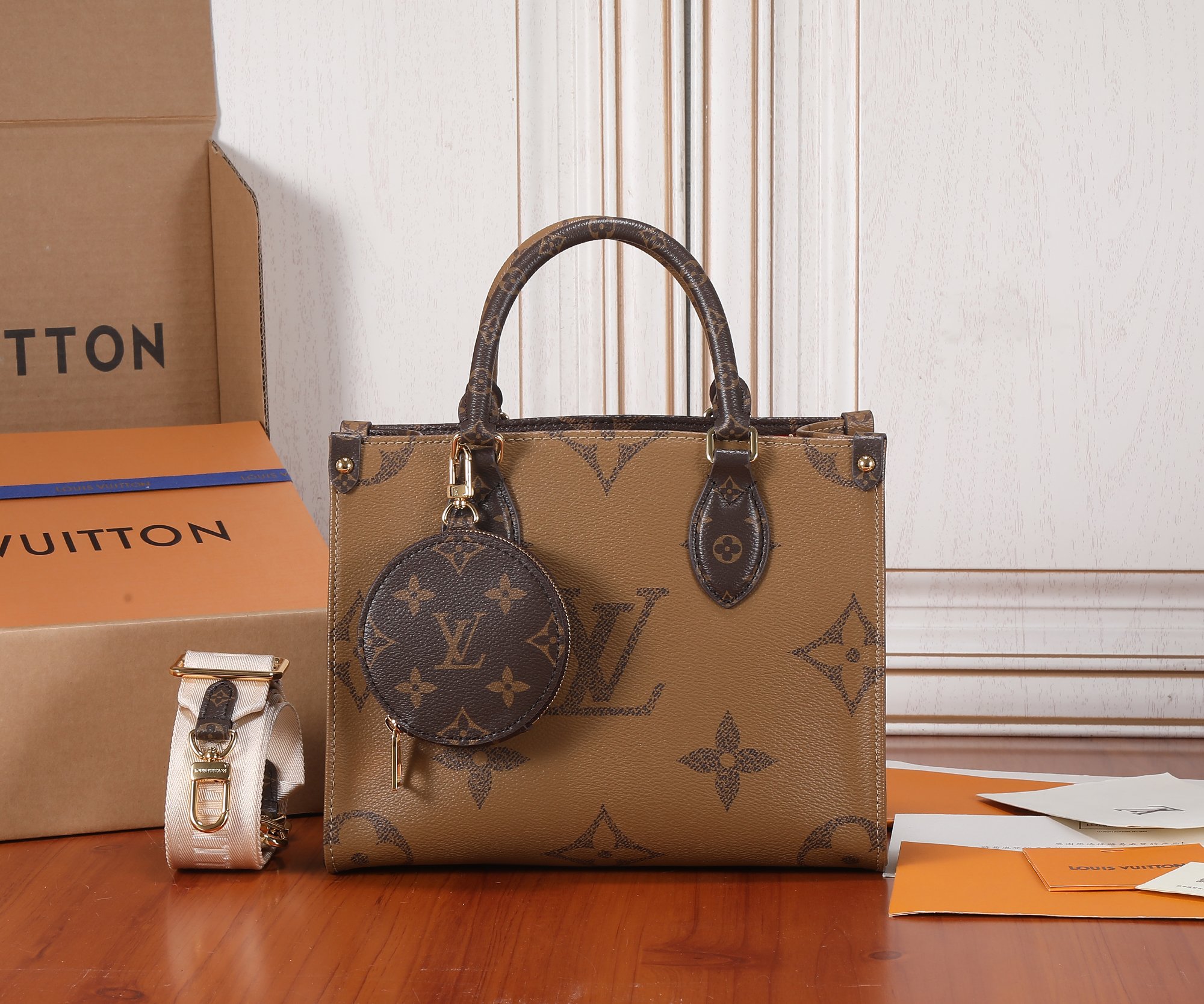 Louis Vuitton OnTheGo Small Handbag in Monogram and Monogram Reverse Canvas