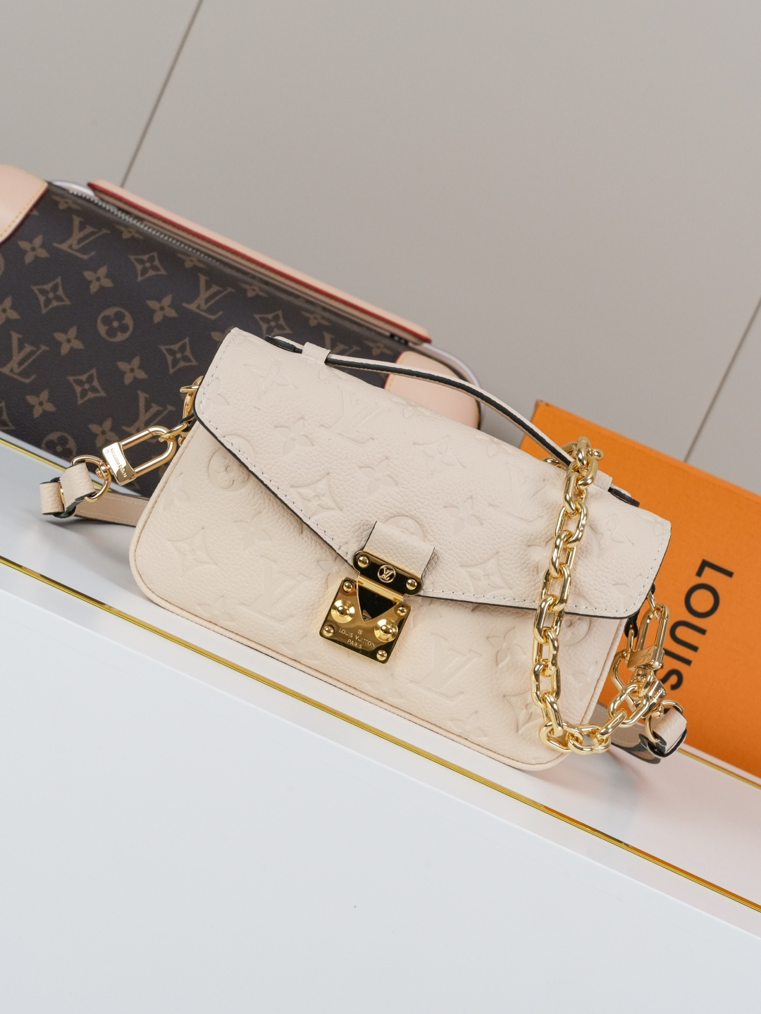Pochette Métis East West Bag in Cream Monogram Empreinte Leather