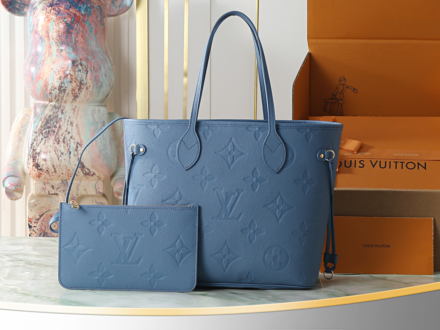 Neverfull MM Tote Bag in Blue Monogram Empreinte Leather