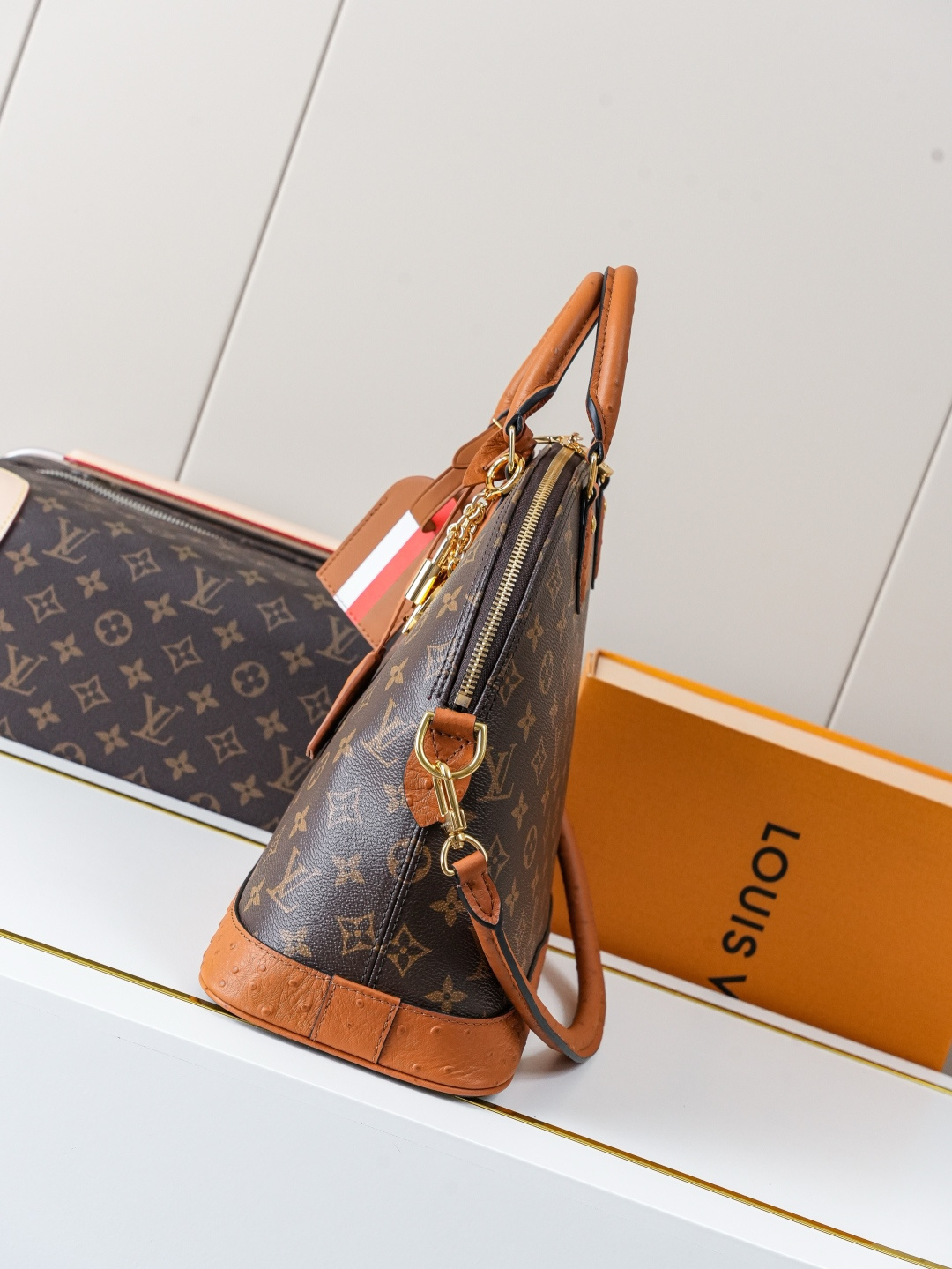 Louis Vuitton Alma Medium Handbag in Monogram Canvas with Ostrich Leather Trim - Image 2