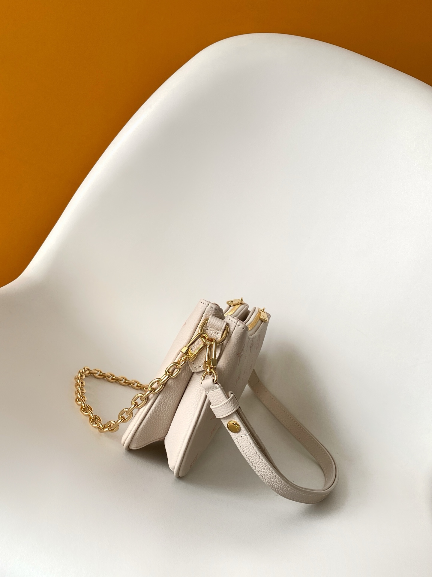 Louis Vuitton Liv Pochette in Monogram Empreinte Leather - Image 3