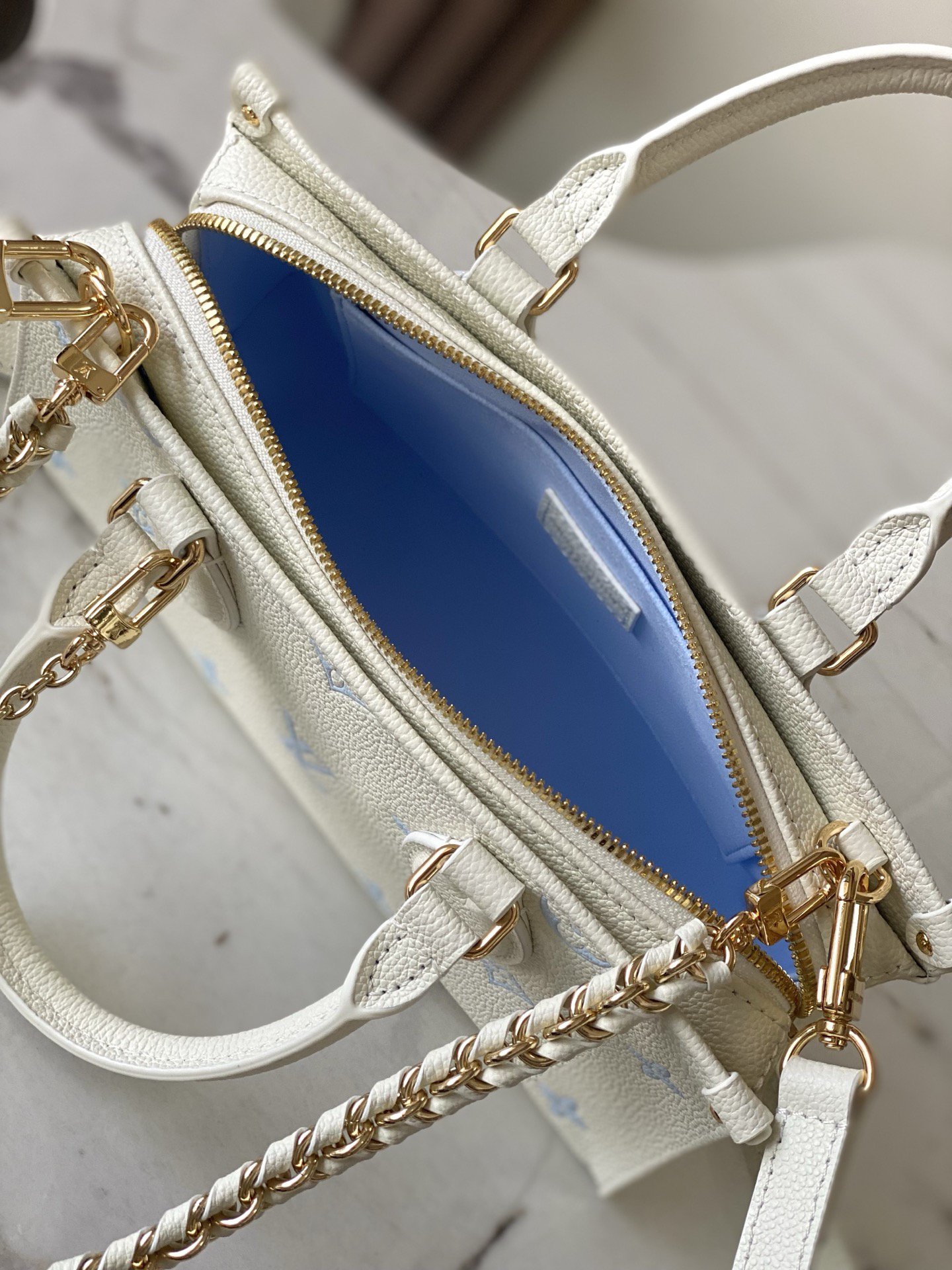 Louis Vuitton OnTheGo EW Monogram Empreinte Leather Tote Bag in Sea Salt Blue - Image 8