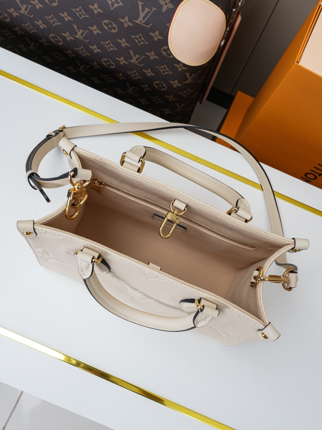 Louis Vuitton OnTheGo Small Handbag in Cream Monogram Empreinte Leather - Image 8