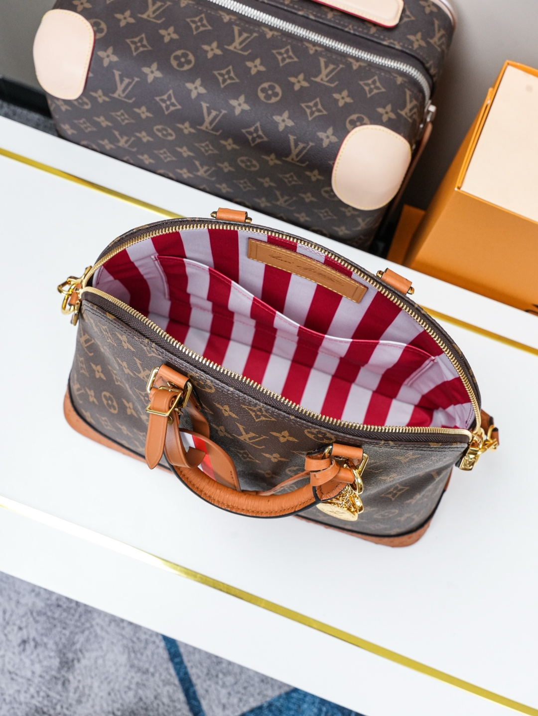 Louis Vuitton Alma Medium Handbag in Monogram Canvas with Ostrich Leather Trim - Image 8